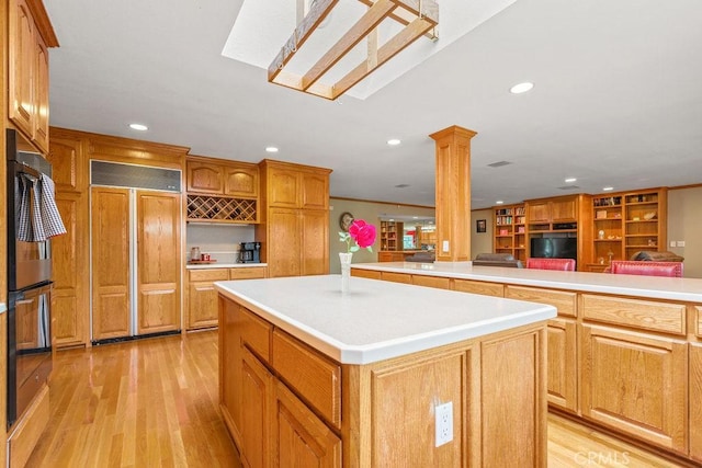 130 N Avenida Veracruz, Anaheim, CA 92808 - kitchen featuring recessed lighting, a kitchen island, paneled fridge, and light wood-style flooring