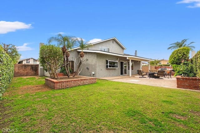 130 N Avenida Veracruz, Anaheim, CA 92808 - back of house with fence, a patio, stucco siding, and a yard