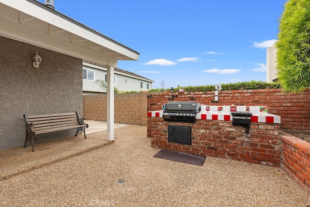 130 N Avenida Veracruz, Anaheim, CA 92808 - view of patio with exterior kitchen, fence, and a grill