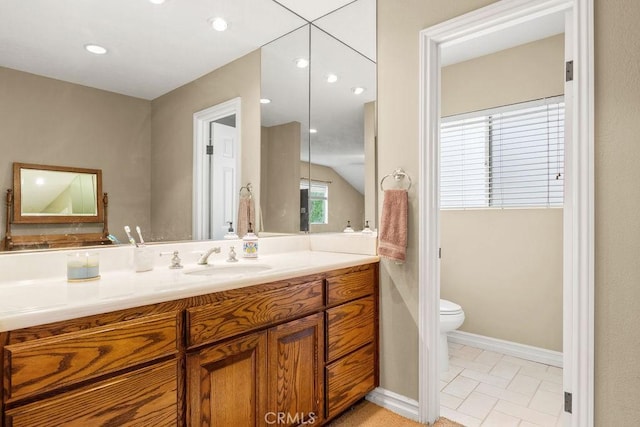130 N Avenida Veracruz, Anaheim, CA 92808 - bathroom featuring vanity, baseboards, toilet, lofted ceiling, and recessed lighting
