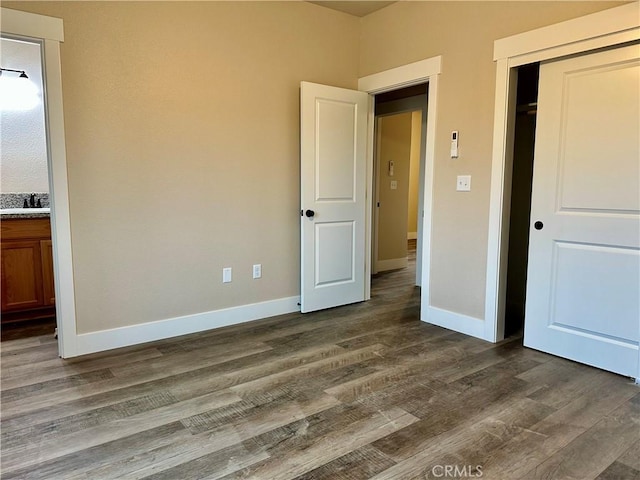 1411 Elliott Rd, Paradise, CA 95969 - unfurnished bedroom with dark wood-type flooring, a closet, and ensuite bath
