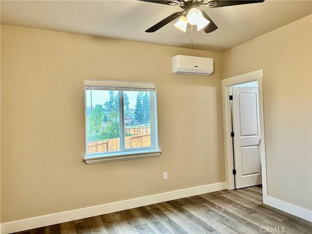 1411 Elliott Rd, Paradise, CA 95969 - empty room with a wall mounted air conditioner, wood finished floors, and ceiling fan