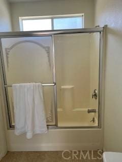 586 W 1st St, San Pedro, CA 90731 - full bath featuring combined bath / shower with glass door, a healthy amount of sunlight, and toilet