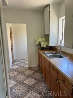586 W 1st St, San Pedro, CA 90731 - kitchen with brown cabinets and a sink
