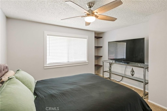 27633 Nugget Dr Unit 1, Canyon Country, CA 91387 - carpeted bedroom with a ceiling fan, baseboards, and a textured ceiling