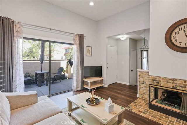 27633 Nugget Dr Unit 1, Canyon Country, CA 91387 - living room featuring baseboards, a brick fireplace, wood finished floors, and recessed lighting