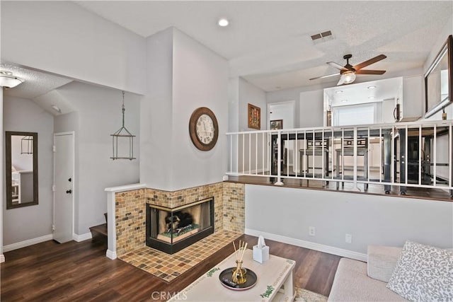27633 Nugget Dr Unit 1, Canyon Country, CA 91387 - living room featuring a ceiling fan, wood finished floors, stairs, baseboards, and visible vents