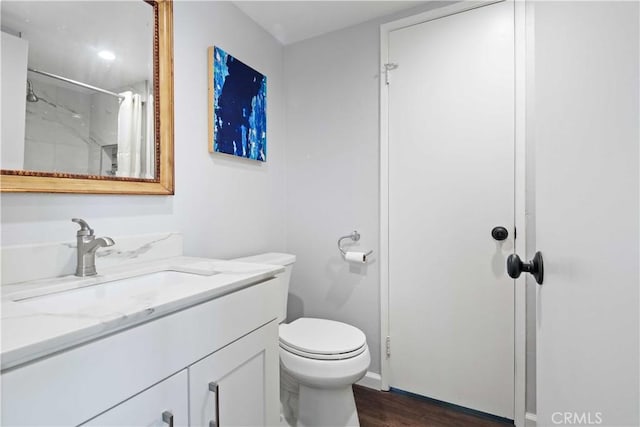 27633 Nugget Dr Unit 1, Canyon Country, CA 91387 - full bath featuring toilet, baseboards, wood finished floors, curtained shower, and vanity