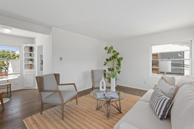 living area featuring wood finished floors and baseboards