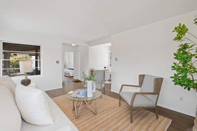 living area featuring wood finished floors and baseboards