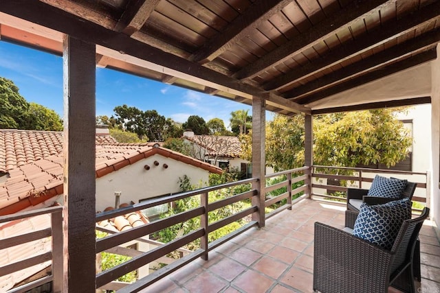 view of patio featuring a balcony
