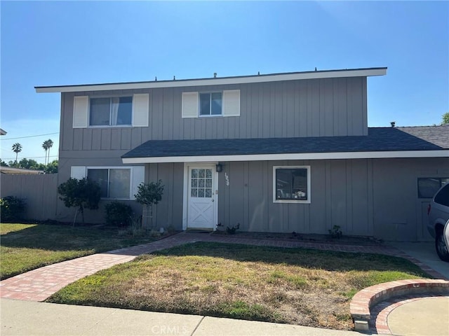 1936 Arcane St, Simi Valley, CA 93065 - view of front of home with fence, a shingled roof, and a front yard