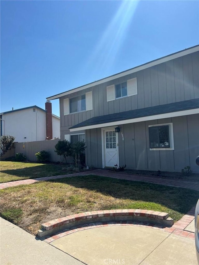 1936 Arcane St, Simi Valley, CA 93065 - view of front facade featuring fence, board and batten siding, and a front yard
