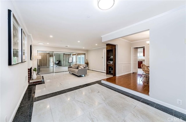 living room featuring recessed lighting, crown molding, and baseboards