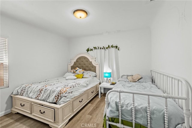 8912 Elizabeth Ave, South Gate, CA 90280 - bedroom with light wood-type flooring and baseboards