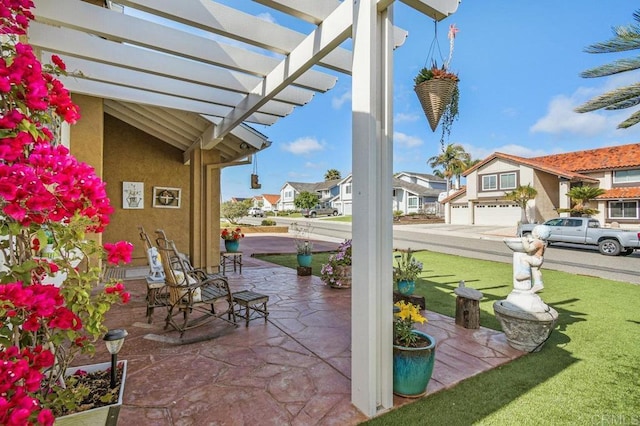 view of patio / terrace with a residential view and a pergola