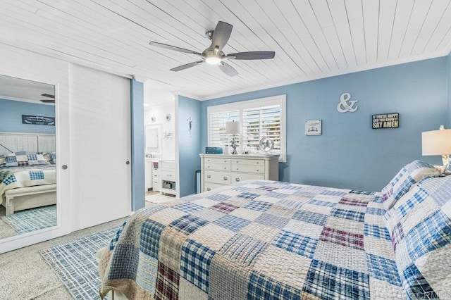 bedroom featuring ornamental molding, wood ceiling, and a ceiling fan