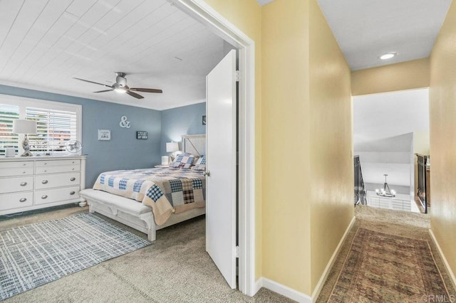 bedroom with carpet floors, baseboards, and ceiling fan with notable chandelier