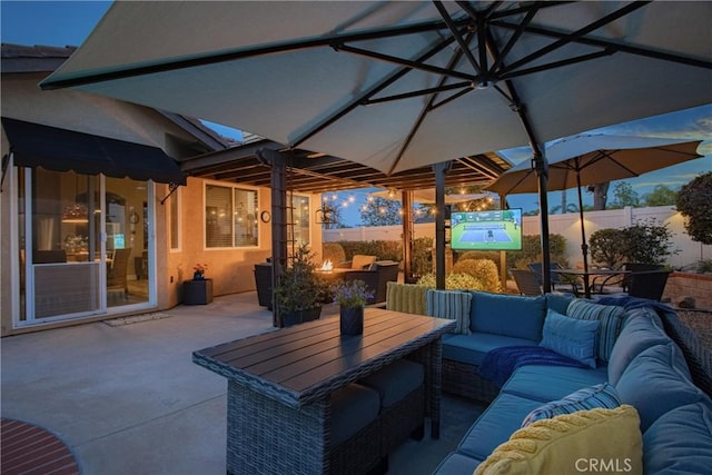 view of patio featuring outdoor lounge area, outdoor dining area, and a fenced backyard