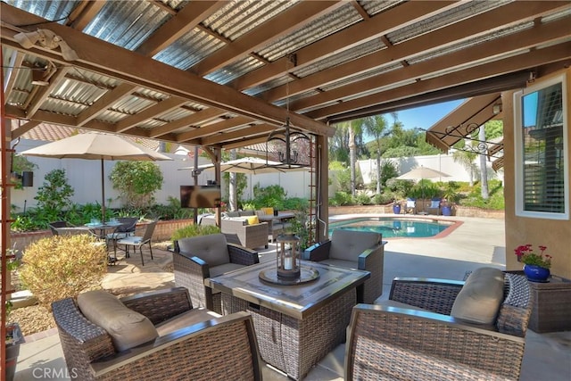 view of patio / terrace featuring a fenced backyard, an outdoor living space, and a fenced in pool