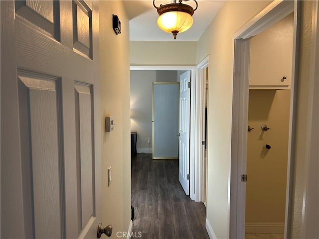 2576 E Coventry Cir Unit 98, Fullerton, CA 92833 - hallway featuring dark wood finished floors and baseboards