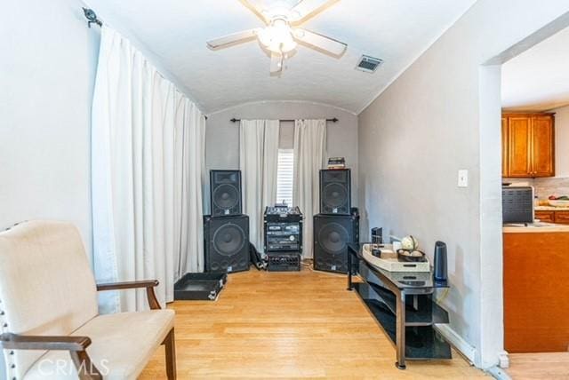6114 Allston St, Los Angeles, CA 90022 - sitting room with vaulted ceiling, light wood-type flooring, visible vents, and a ceiling fan