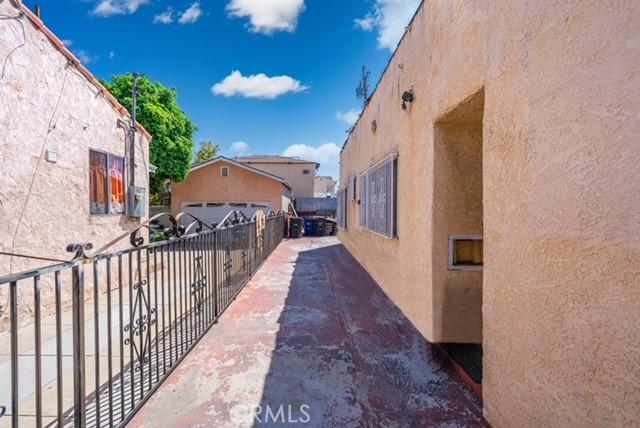 6114 Allston St, Los Angeles, CA 90022 - view of home's exterior featuring stucco siding and fence