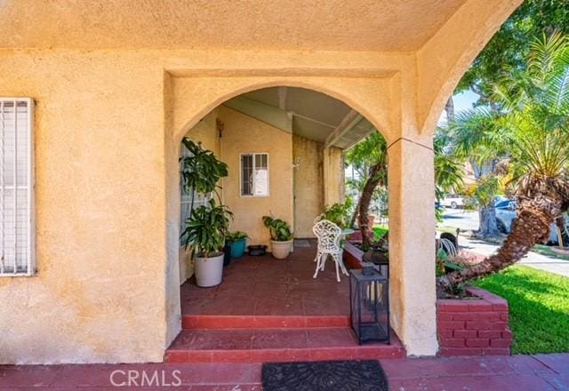 6114 Allston St, Los Angeles, CA 90022 - property entrance featuring stucco siding