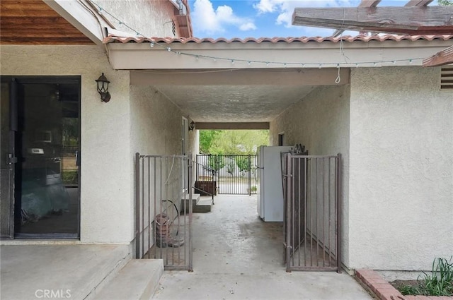 exterior space featuring a gate