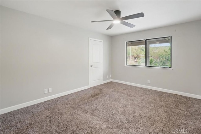 unfurnished room featuring baseboards, carpet floors, and ceiling fan