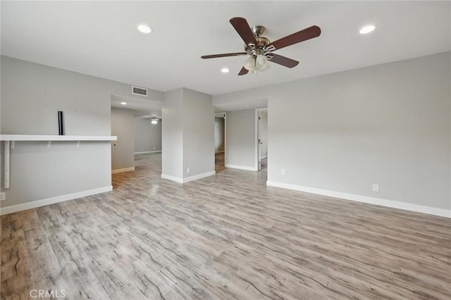 unfurnished room with a ceiling fan, light wood-style floors, visible vents, and recessed lighting