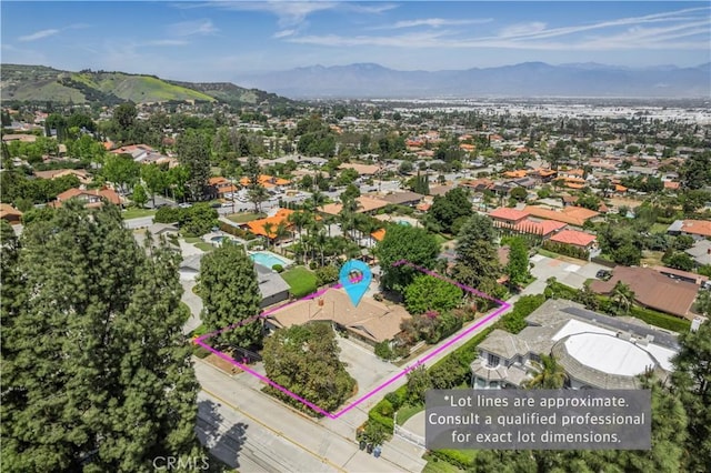 aerial view with a mountain view and a residential view