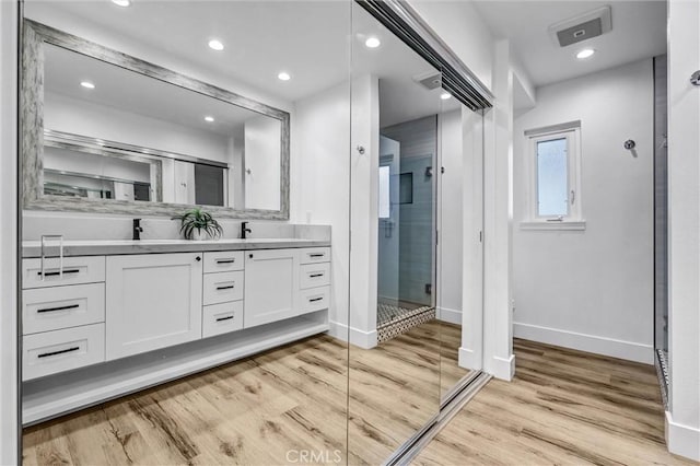 334 Tours Ln, Costa Mesa, CA 92627 - full bath with vanity, a stall shower, wood finished floors, and recessed lighting