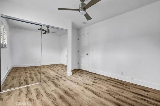 334 Tours Ln, Costa Mesa, CA 92627 - unfurnished bedroom featuring wood finished floors, a closet, and ceiling fan