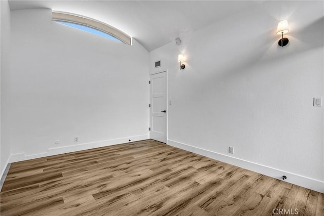 334 Tours Ln, Costa Mesa, CA 92627 - unfurnished room with lofted ceiling and wood finished floors