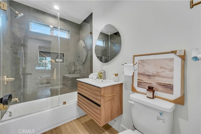 8519 Wakefield Ave, Panorama City, CA 91402 - full bathroom featuring wood finished floors, enclosed tub / shower combo, vanity, and toilet
