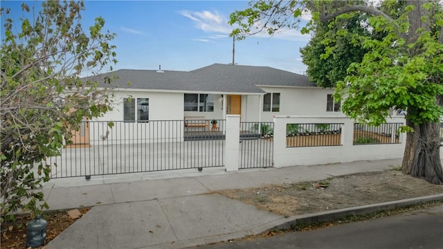 8519 Wakefield Ave, Panorama City, CA 91402 - view of front of house featuring a shingled roof and a fenced front yard
