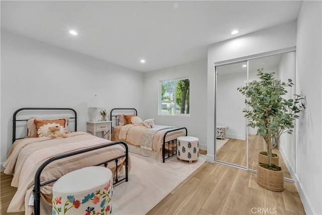 8519 Wakefield Ave, Panorama City, CA 91402 - bedroom with baseboards, wood finished floors, recessed lighting, and a closet
