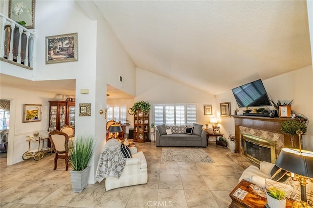 9527 Manzanita Dr, Rancho Cucamonga, CA 91737 - living room featuring plenty of natural light, a tiled fireplace, and high vaulted ceiling
