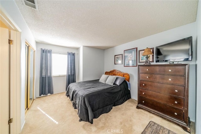 9527 Manzanita Dr, Rancho Cucamonga, CA 91737 - bedroom with a textured ceiling, light colored carpet, and visible vents