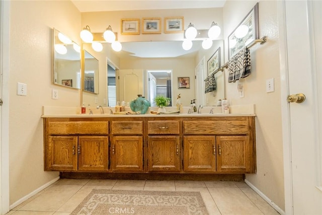 9527 Manzanita Dr, Rancho Cucamonga, CA 91737 - full bathroom with baseboards, tile patterned floors, double vanity, and a sink