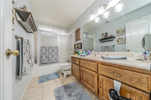 9527 Manzanita Dr, Rancho Cucamonga, CA 91737 - bathroom featuring tile patterned floors, bath / shower combo with glass door, toilet, visible vents, and vanity