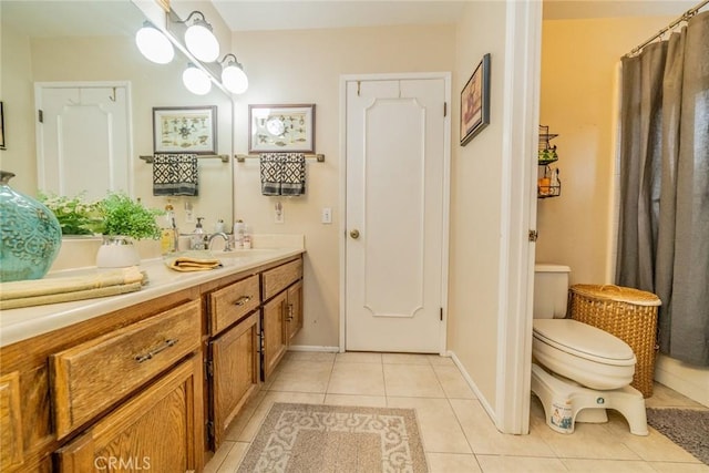 9527 Manzanita Dr, Rancho Cucamonga, CA 91737 - full bath with vanity, toilet, tile patterned flooring, and baseboards