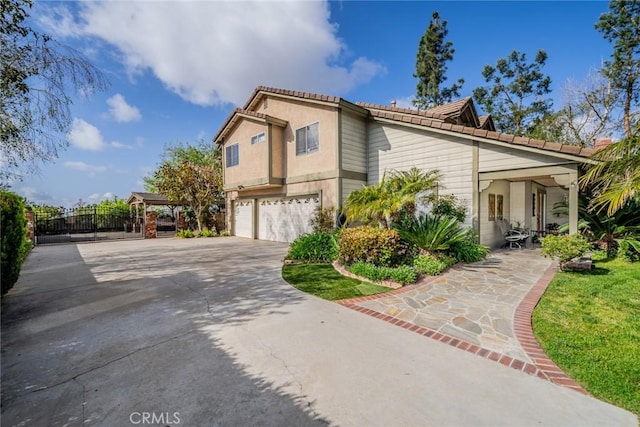 9527 Manzanita Dr, Rancho Cucamonga, CA 91737 - view of side of property with a garage, stucco siding, concrete driveway, and a gate