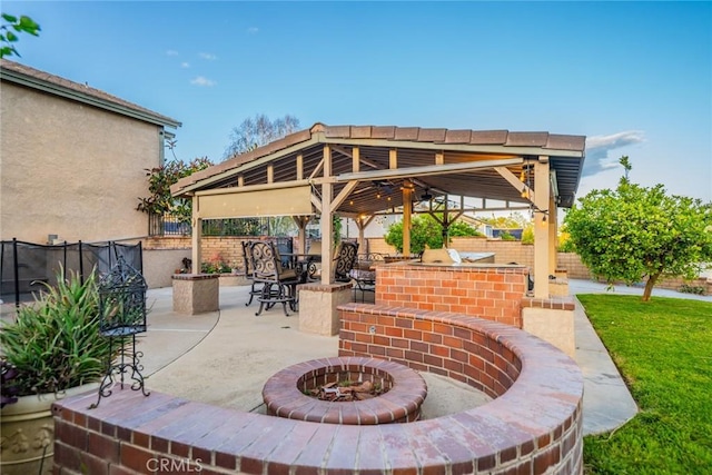 9527 Manzanita Dr, Rancho Cucamonga, CA 91737 - view of patio / terrace with a gazebo, exterior bar, a fenced backyard, and an outdoor fire pit