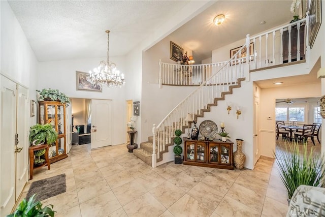 9527 Manzanita Dr, Rancho Cucamonga, CA 91737 - entryway with high vaulted ceiling, a chandelier, and stairs