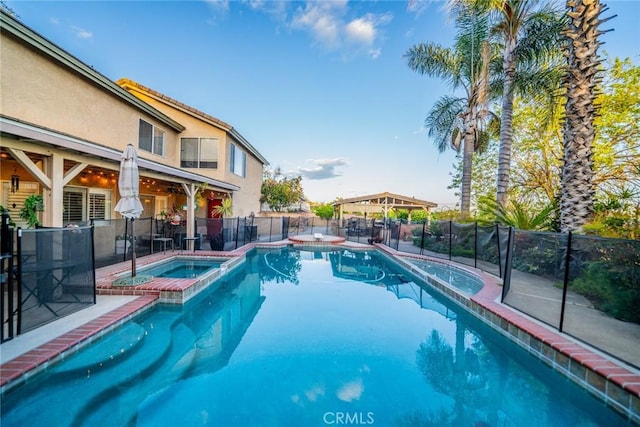 9527 Manzanita Dr, Rancho Cucamonga, CA 91737 - view of swimming pool with fence and a pool with connected hot tub