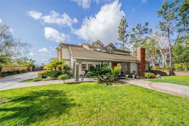 9527 Manzanita Dr, Rancho Cucamonga, CA 91737 - view of front of house featuring a chimney and a front lawn