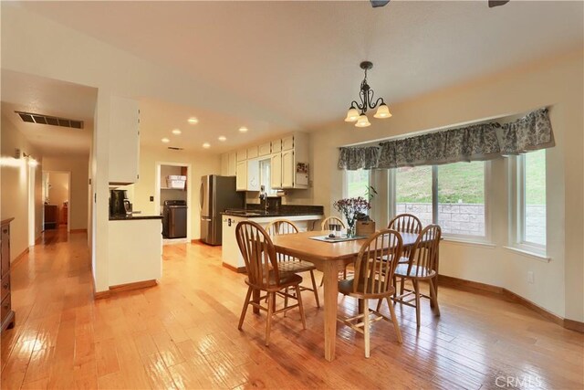 41820 Dillon Cir, Ahwahnee, CA 93601 - dining room with light wood-style floors, baseboards, a chandelier, and recessed lighting