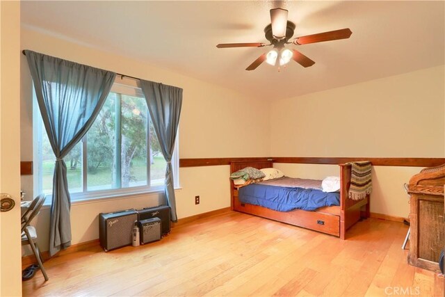41820 Dillon Cir, Ahwahnee, CA 93601 - bedroom with wood finished floors, multiple windows, and ceiling fan